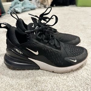 Gently worn Nike tennis shoes, black, size women’s 6